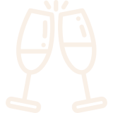 Two champagne glasses clinking together in a celebratory gesture.