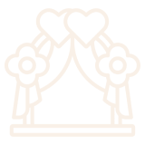 Outline of a wedding arch with two hearts, draped fabric, and flowers.
