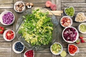 a bowl of green salad and other veggies